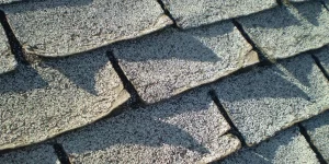 Why are the shingles on my roof curling up?