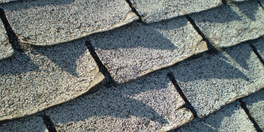 Why are the shingles on my roof curling up?