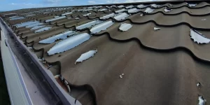 Why is the paint peeling off my roof and how do I fix it?